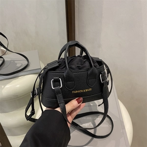 Black pebbled leather mini crossbody bag with drawstring closure and golden logo