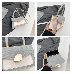 Detail of color-block crossbody bag featuring grey woven texture and crocodile pattern