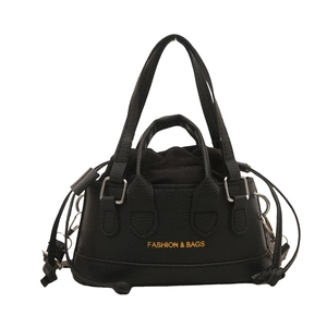 Fashionable black pebbled leather bucket bag with top handles and drawstring closure