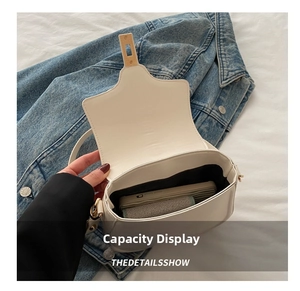 Top view of cream saddle bag interior capacity showing phone and wallet storage