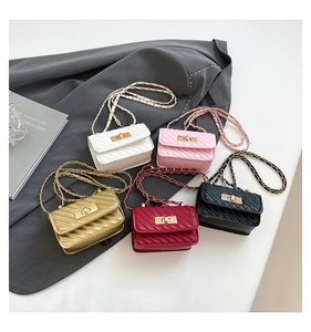Detailed display of mini quilted crossbody bags in five colors with golden chain straps