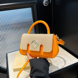Orange faux leather and beige woven fabric crossbody bag with round gold hardware buckle