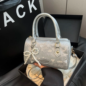 Silver snake pattern Boston handbag with pearl bow pendant and metallic finish