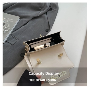 Interior view showing capacity for phone and cosmetics in a beige flap shoulder bag