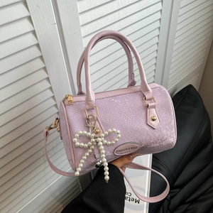 Lavender snake-embossed Boston handbag with pearl bow and detachable shoulder strap
