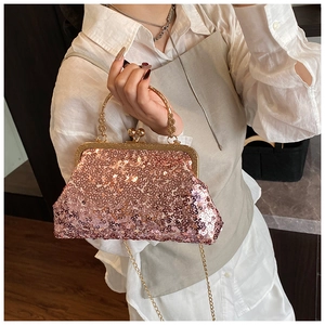 Detail of rose gold sequin evening bag with metallic ring handle and pearl chain strap