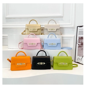 Detail view of colorful PU leather crossbody bags with golden oval buckles in seven shades