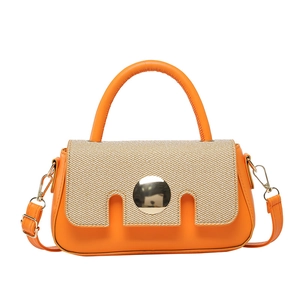 French style orange leather and raffia handbag with a large gold metal buckle