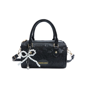 Chic black snake-texture pillow bag with pearl bow charm and crossbody strap