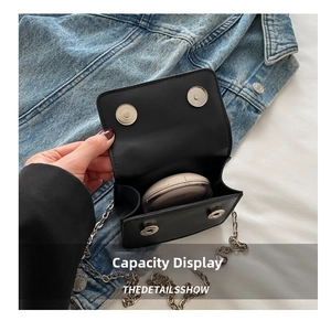 Internal view of mini chain crossbody bag showing capacity for daily essentials