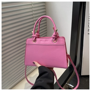 Pink matte PU leather handbag with embossed fashion trend text and knot handle