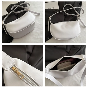 Detailed views of a white crescent moon underarm bag with gold zippers and adjustable strap