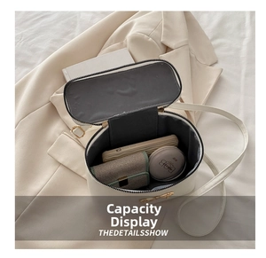 Interior view showing the storage capacity of a white box-shaped crossbody bag