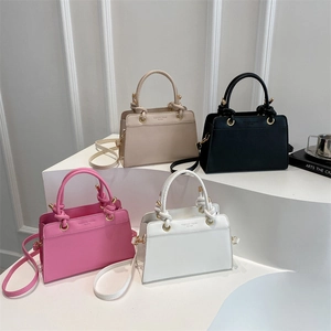 Minimalist square crossbody bags in pink, white, beige, and black with knot handle detail