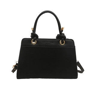 Large black matte shoulder bag with knot details and embossed fashion trend typography