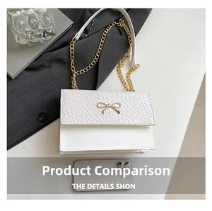 Detail of white woven texture shoulder bag with golden bow buckle and chain strap
