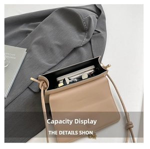 Detailed interior of apricot crossbody bag showing storage for phone and lipstick