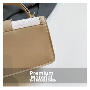 Close-up of khaki PU leather stitching and white woven edge details on women's handbag