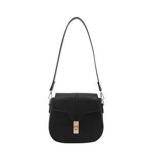 Classic black saddle bag with gold swivel lock and adjustable strap on white background