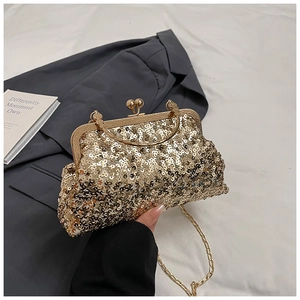 Close-up of gold sequin evening clutch with kiss-lock closure and elegant chain strap