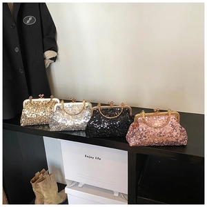 Collection of sequined evening clutch bags in gold, silver, black, and pink with ring handles