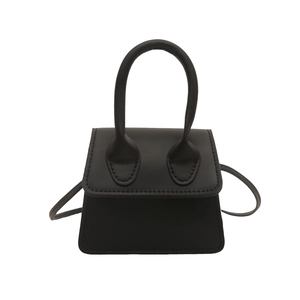 Retro black trapezoid mini handbag with oversized curved handle and shoulder strap
