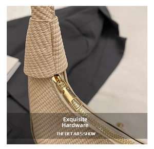 Close-up of golden hardware and detailed woven texture on the moon-shaped bag