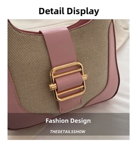 Macro shot of golden square metal buckle on pink leather and khaki canvas patchwork bag