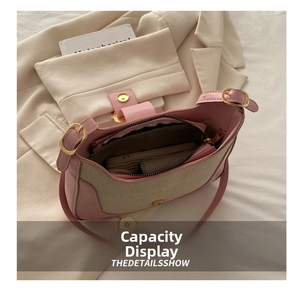 Interior view of patchwork shoulder bag showing main compartment and zipper pocket