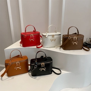 Square box crossbody bags with bow in five colors: red, white, brown, tan, and black