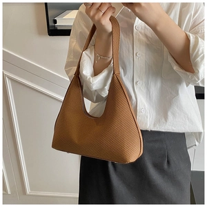 Detail of vintage brown crescent bag showing high-quality mesh texture and minimalist design