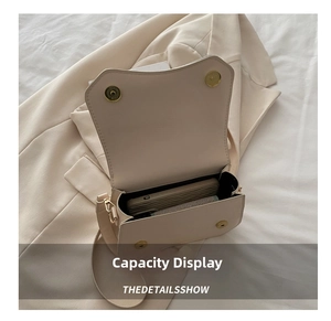 Interior view of beige crossbody bag showing ample space for a large smartphone