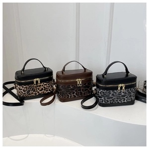 Three leopard print box bags in different colors with gold hardware and top handles