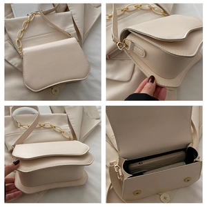 Detail view of beige PU shoulder bag featuring wave flap design and resin chain strap