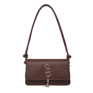 Brown crocodile embossed shoulder bag with gold S-logo and fringe tassel detail