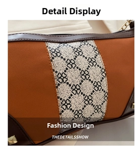 Detail view of vintage orange matte fabric with clover print and gold rivet studs