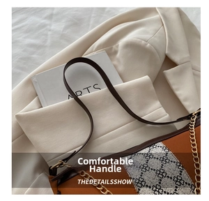 Detail of color-block shoulder bag with brown leather, floral canvas, and gold chain