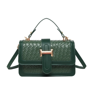 Green woven and crocodile texture crossbody bag with gold buckle and top handle