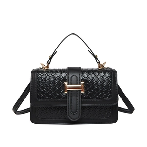 Classic black woven texture handbag with gold metal clasp for elegant women's fashion