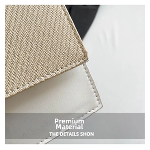 Close-up of contrast stitching on white faux leather and woven straw fabric materials