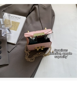 Internal view of a small pink crossbody chain bag showing lipstick storage capacity
