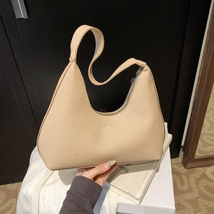 Vintage beige woven crescent hobo bag for women with natural texture and sleek zipper