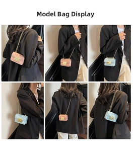 Mini crossbody chain bag styled by model in pink and light blue with gold hardware