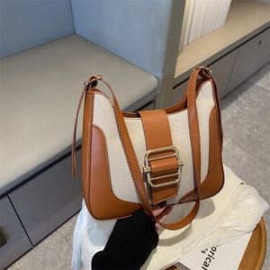 Retro contrast color leather and canvas underarm bag with a bold gold square buckle
