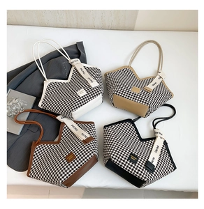 Top view of four checkered tote bags in various colors with stylish chic ribbon details
