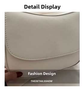 Close-up of white saddle bag showing high-quality leather texture and fine stitching