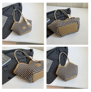 Detail view of houndstooth tote bag with camel leather trim and decorative silk scarf