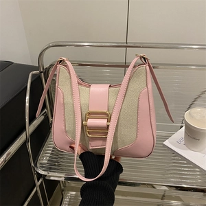 Pink and beige contrast handbag with gold buckle and adjustable shoulder strap