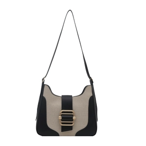Modern two-tone canvas shoulder bag with black leather trim and gold buckle detail