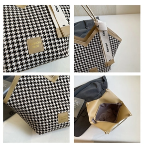 Detail view of houndstooth tote bag featuring leather logo patch and striped canvas handle
